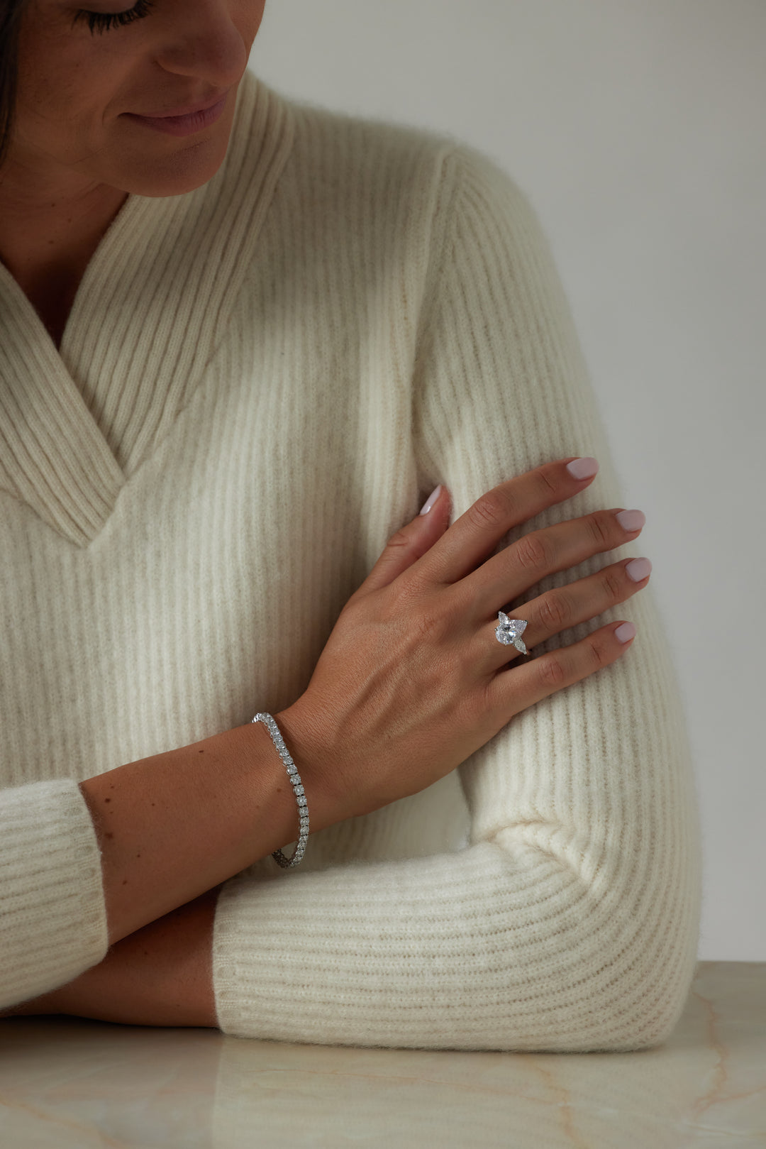 Pear cut three-stone engagement ring by IRALIS featuring lab-grown diamonds in DEF color and VS1–VS2 clarity, Zurich designed