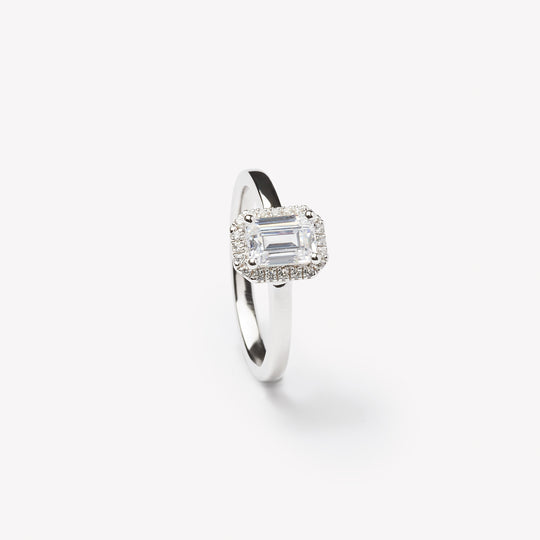 Emerald cut engagement ring with halo by IRALIS featuring lab-grown diamonds, DEF color and VS1–VS2 clarity, Zurich designed