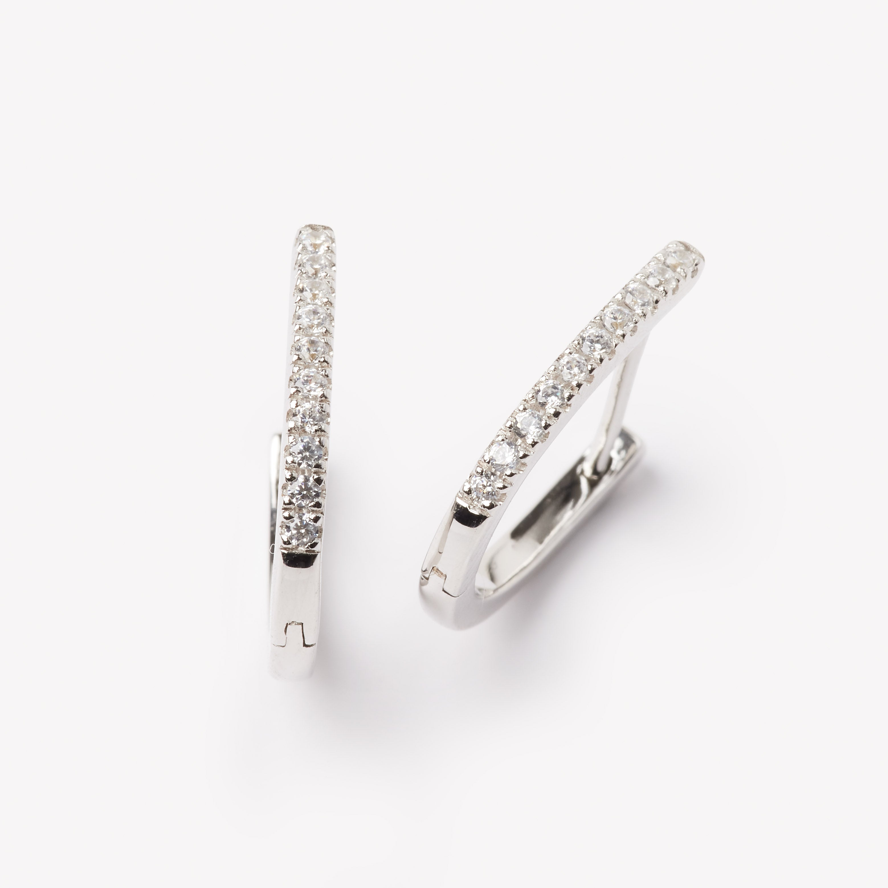 18k gold lab grown diamond earrings. Designed in Zurich.