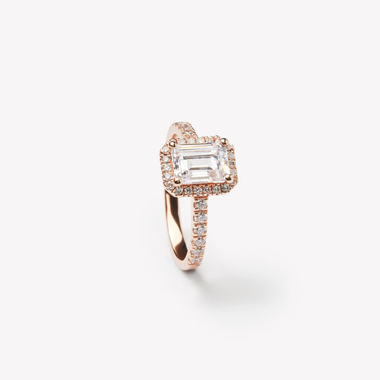 Emerald cut engagement ring with halo by IRALIS featuring lab-grown diamonds, pavé setting, DEF color and VS1–VS2 clarity