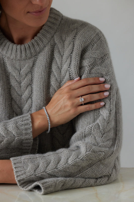 Emerald cut engagement ring with halo by IRALIS featuring lab-grown diamonds, pavé setting, DEF color and VS1–VS2 clarity