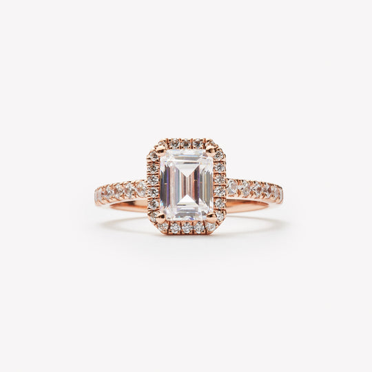 Emerald cut engagement ring with halo by IRALIS featuring lab-grown diamonds, pavé setting, DEF color and VS1–VS2 clarity