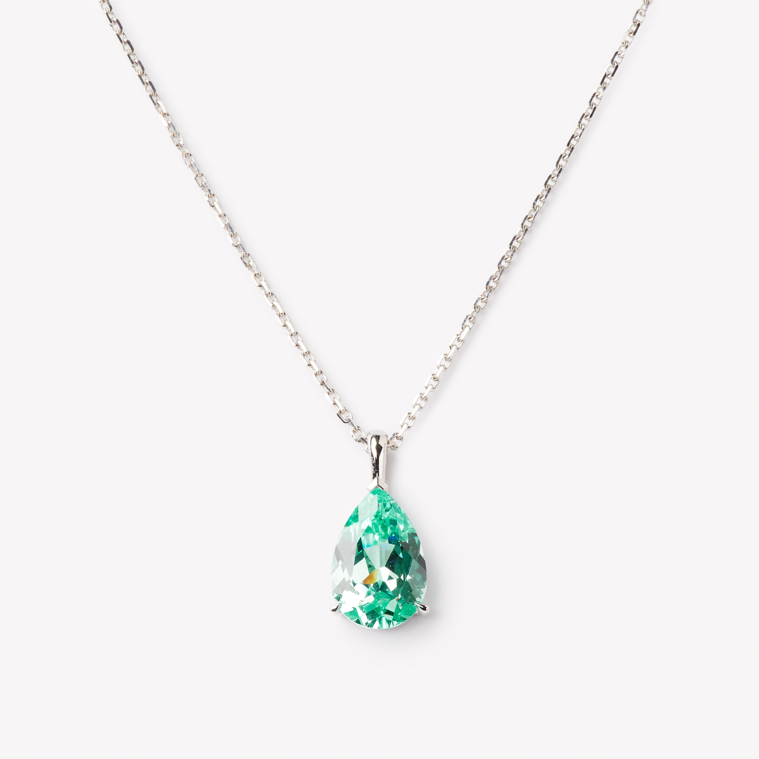 Pear cut necklace by IRALIS featuring lab-grown Paraiba stones in vibrant turquoise, Zurich designed and custom made