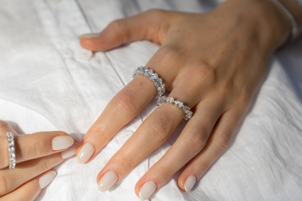 Pear cut eternity ring by IRALIS – Zurich-designed fine jewelry featuring DEF color and VS1–VS2 clarity.