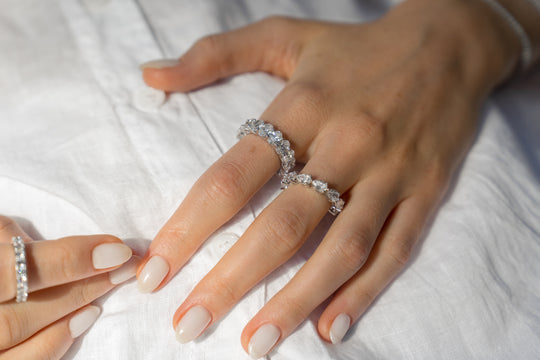 Pear cut eternity ring by IRALIS – Zurich-designed fine jewelry featuring DEF color and VS1–VS2 clarity.