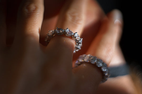 Pear cut eternity ring by IRALIS – Zurich-designed fine jewelry featuring DEF color and VS1–VS2 clarity.