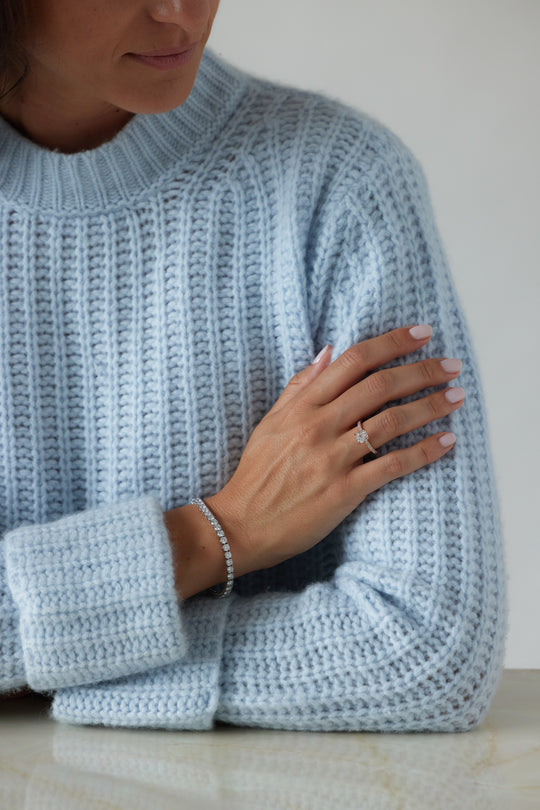 Cushion cut engagement ring by IRALIS featuring lab-grown diamonds with DEF color and VS1–VS2 clarity, Zurich designed