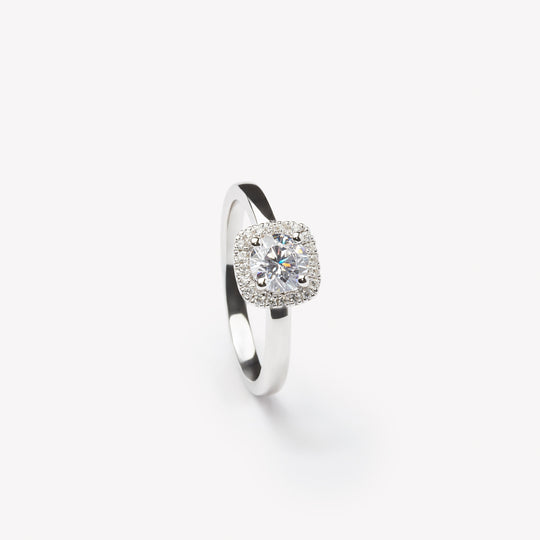 Round cut engagement ring with square halo by IRALIS – Zurich-designed fine jewelry with DEF color and VS1–VS2 clarity.