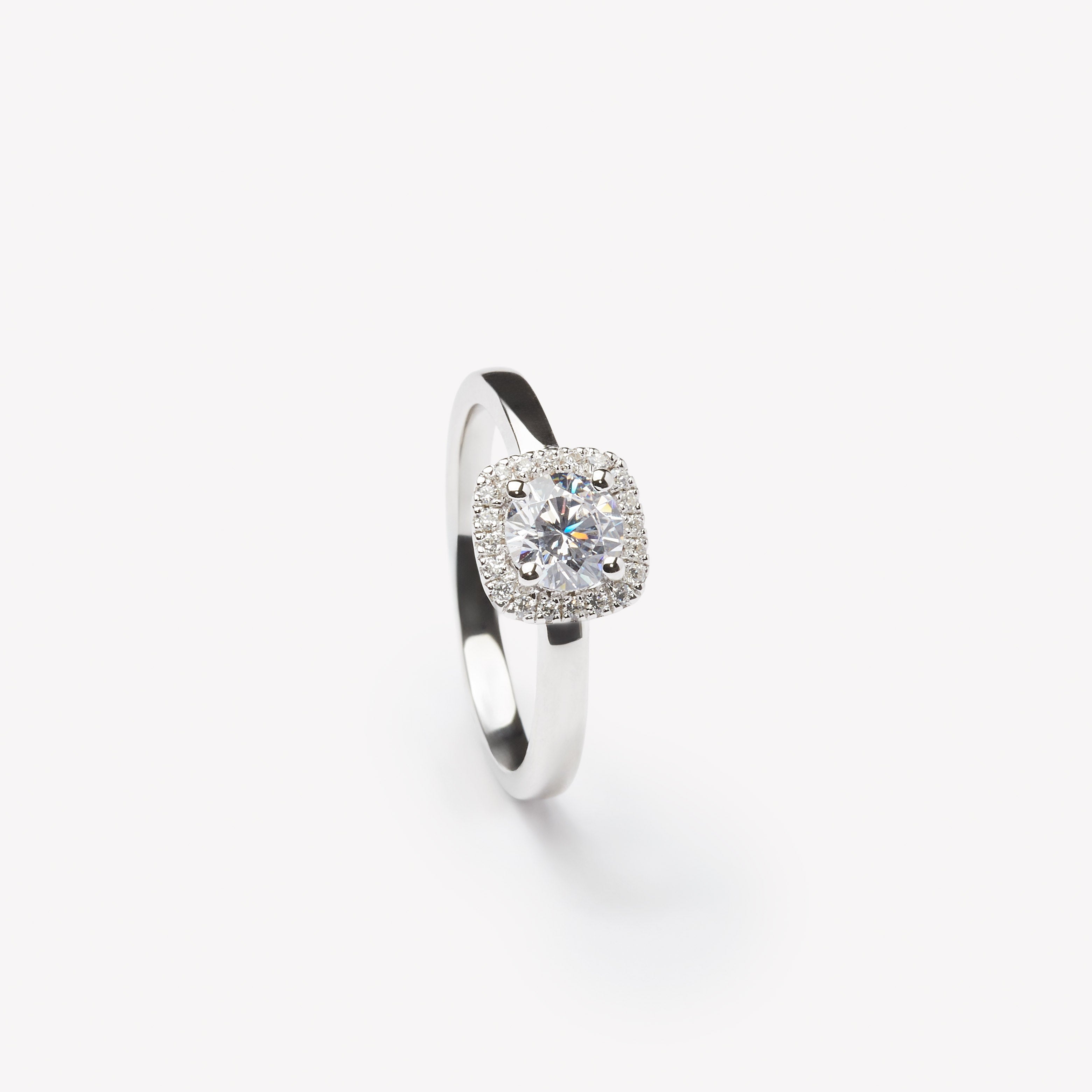 Round cut engagement ring with square halo by IRALIS – Zurich-designed fine jewelry with DEF color and VS1–VS2 clarity.