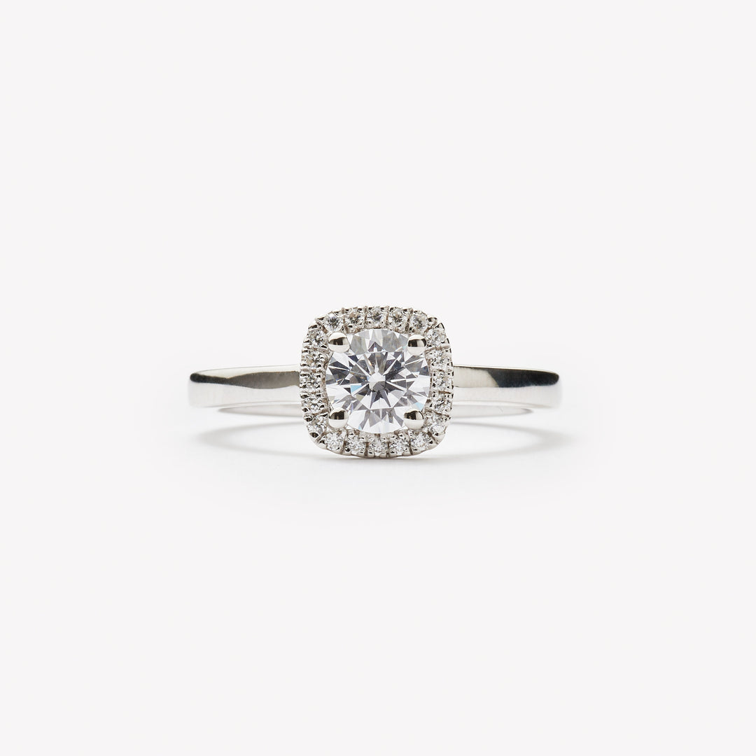 Round cut engagement ring with square halo by IRALIS – Zurich-designed fine jewelry with DEF color and VS1–VS2 clarity.