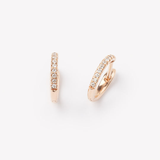 Pair of 18k gold hoop earrings with small lab grown diamonds. 0.1 carats of diamonds