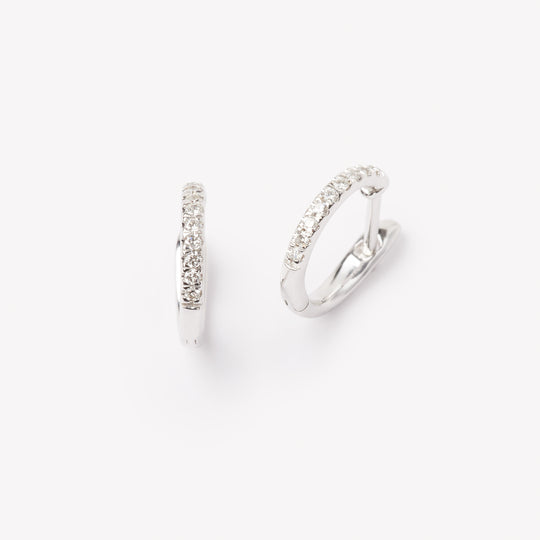 Pair of 18k gold hoop earrings with small lab grown diamonds. 0.1 carats of diamonds