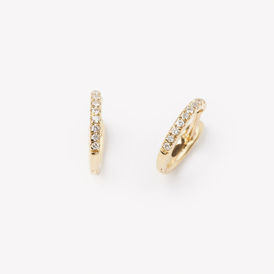 Pair of 18k gold hoop earrings with small lab grown diamonds. 0.1 carats of diamonds
