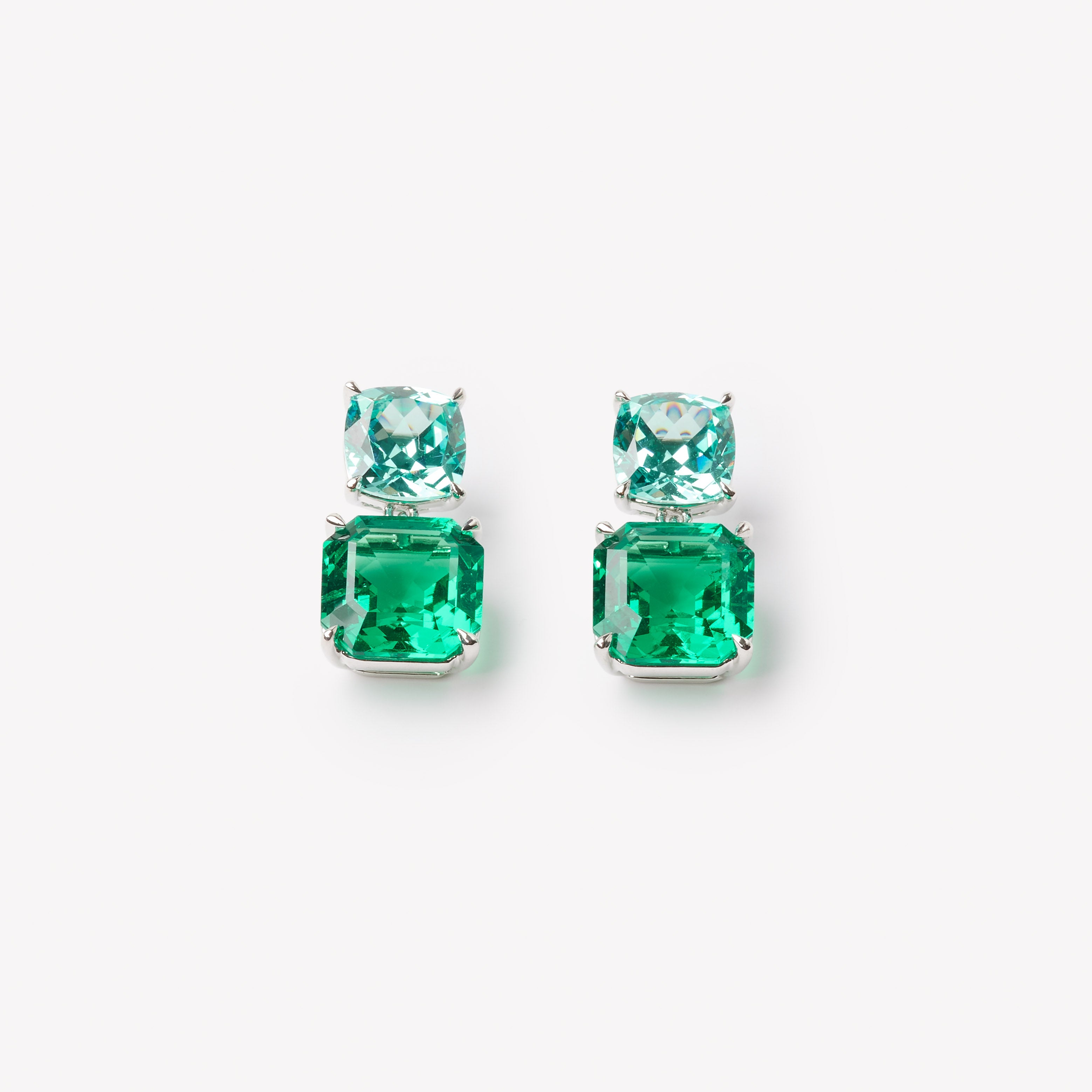 18k gold lab grown emerald and paraiba earrings. Asscher cut with tiger claw prongs. Designed in Zurich.