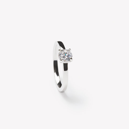 Elegant round brilliant cut engagement ring by IRALIS featuring lab-grown diamonds in DEF color and VS1–VS2 clarity, Zurich designed