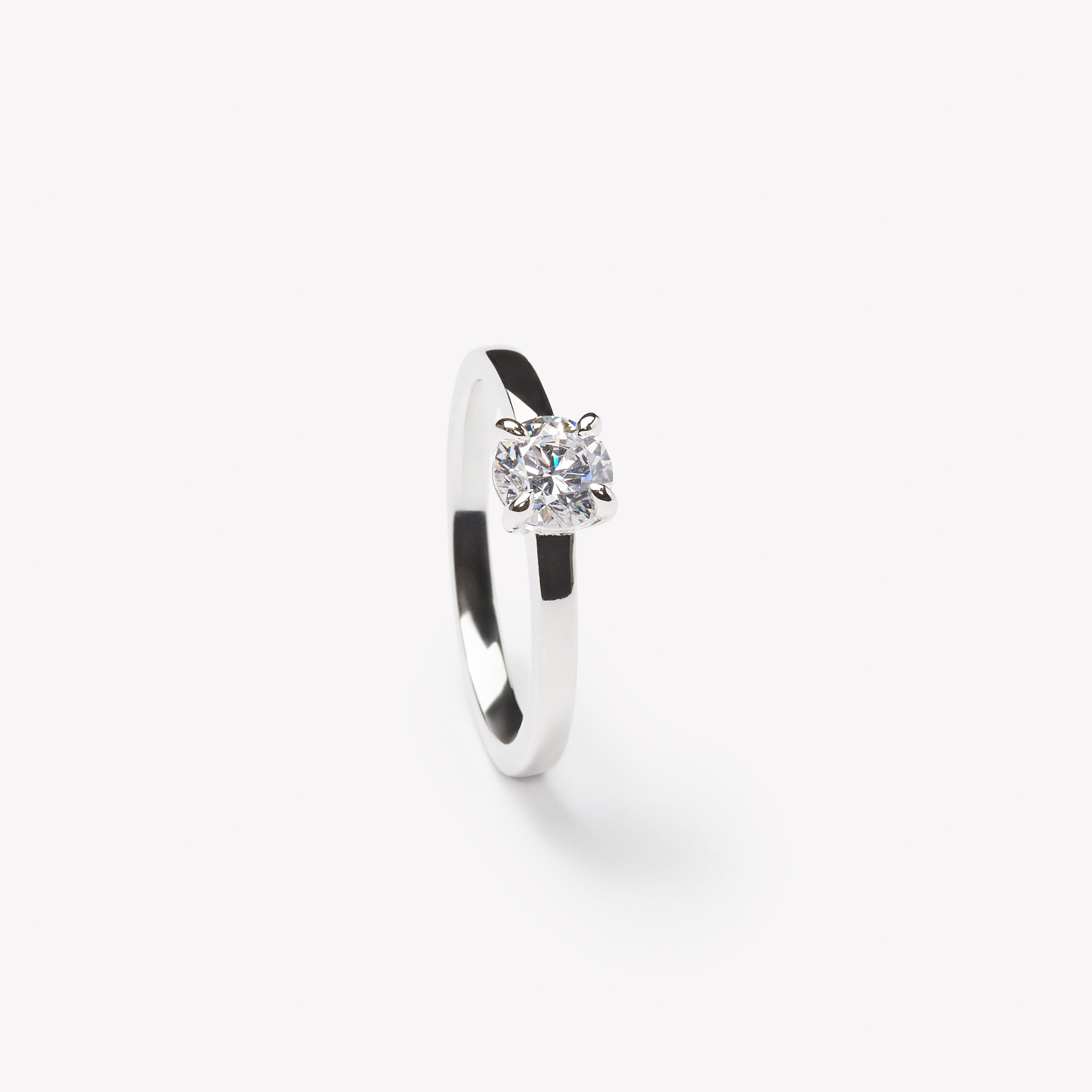 Elegant round brilliant cut engagement ring by IRALIS featuring lab-grown diamonds in DEF color and VS1–VS2 clarity, Zurich designed