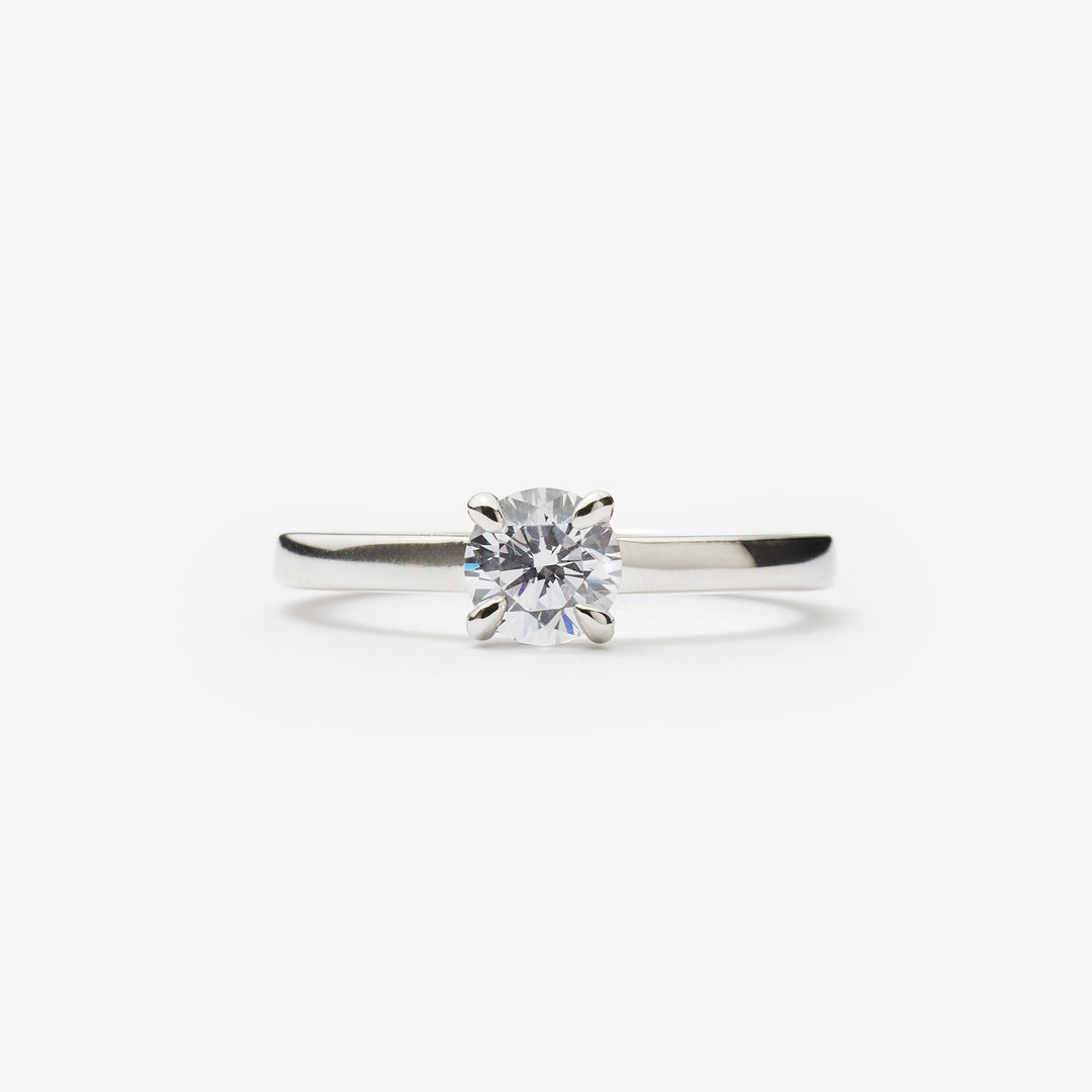 Elegant round brilliant cut engagement ring by IRALIS featuring lab-grown diamonds in DEF color and VS1–VS2 clarity, Zurich designed