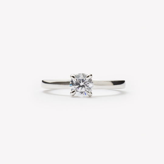 Elegant round brilliant cut engagement ring by IRALIS featuring lab-grown diamonds in DEF color and VS1–VS2 clarity, Zurich designed