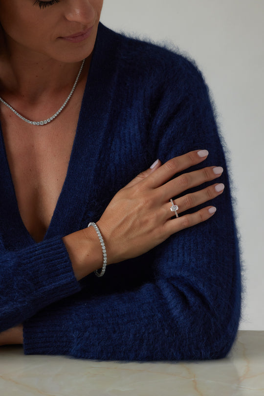 Radiant cut engagement ring by IRALIS with pave band and lab-grown diamonds in DEF color, VS1–VS2 clarity, Zurich designed