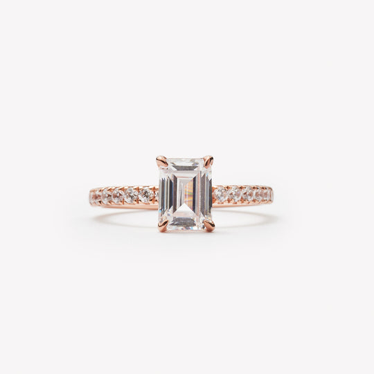 Emerald cut engagement ring by IRALIS with pave setting and lab-grown diamonds in DEF color, VS1–VS2 clarity, Zurich designed