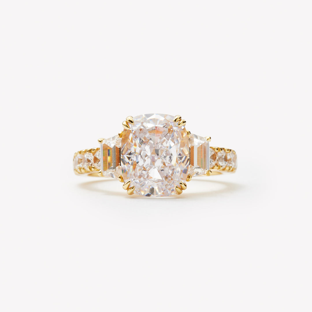 Elongated cushion cut three-stone ring by IRALIS with pavé setting, lab-grown diamonds, DEF color and VS1–VS2 clarity, Zurich designed