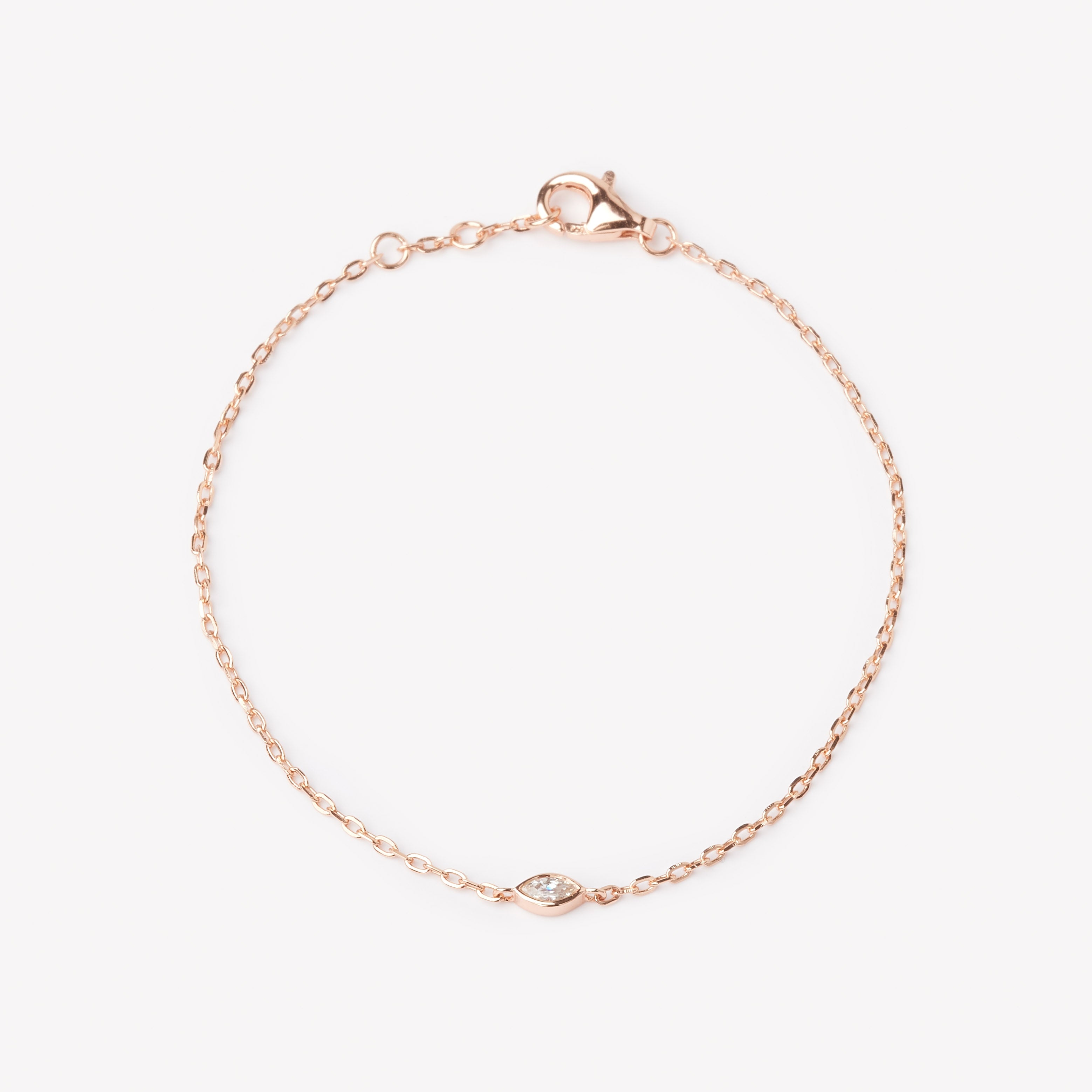 18k rose gold bracelet with small marquise cut lab grown diamond pendant.