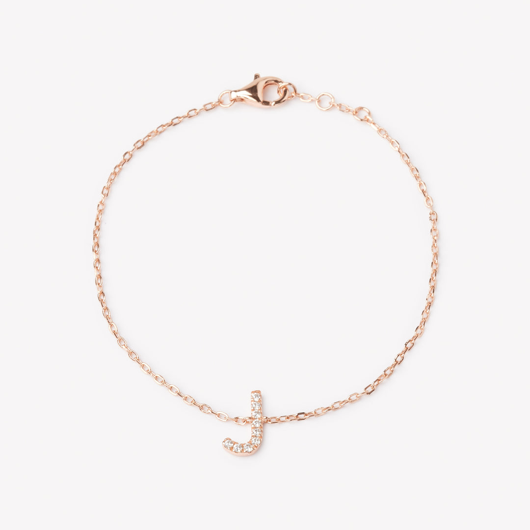 18k rose gold initial bracelet with a lab grown diamond letter 'J' charm.