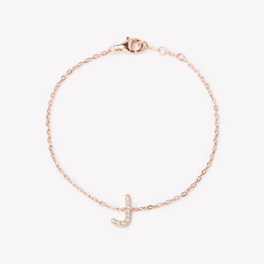 18k rose gold initial bracelet with a lab grown diamond letter 'J' charm.
