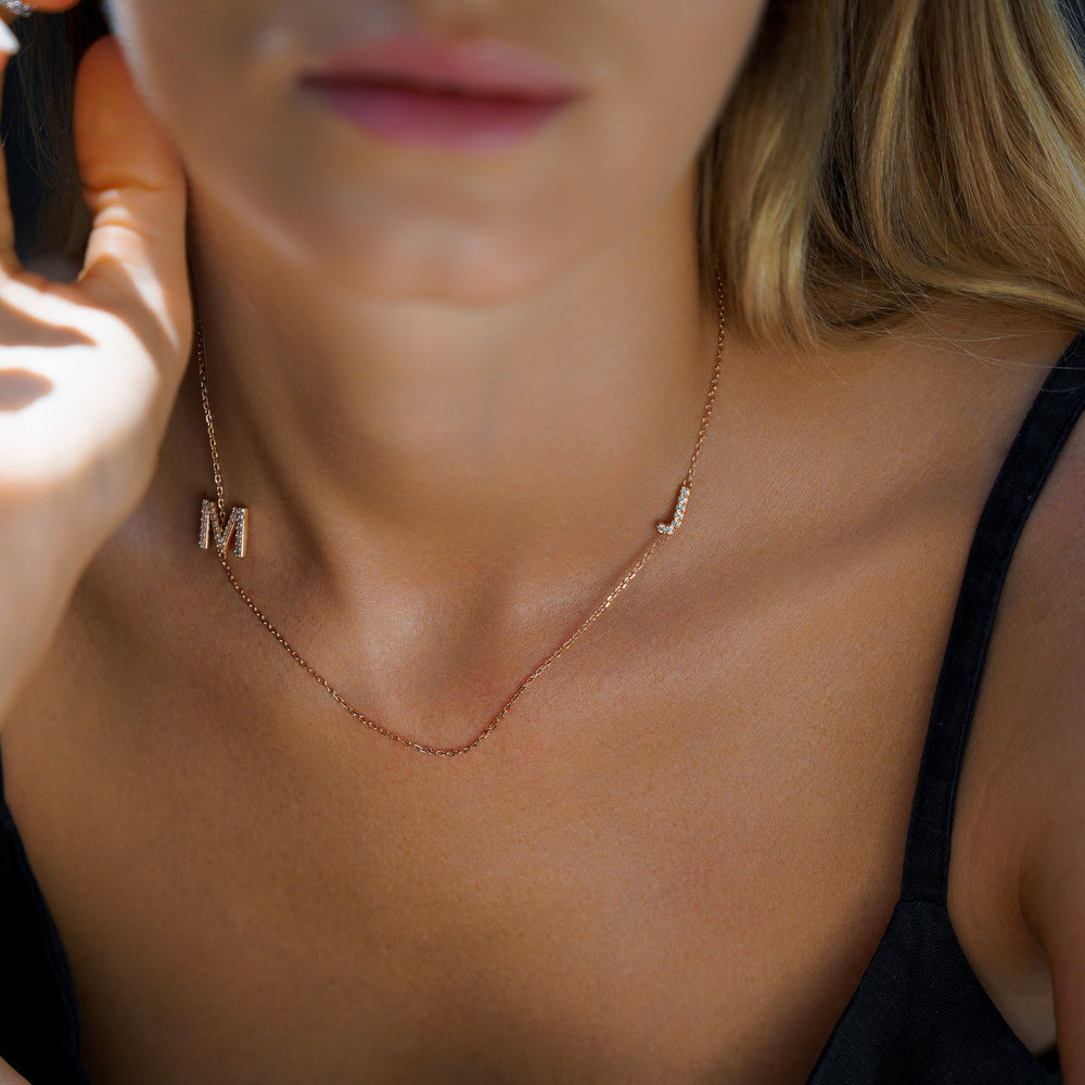 Custom initial necklace by IRALIS with lab-grown DEF round diamonds and large 10–12 mm letters, Zurich designed on model