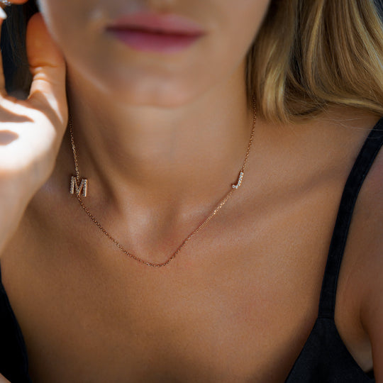 Custom initial necklace by IRALIS with lab-grown DEF round diamonds and large 10–12 mm letters, Zurich designed on model