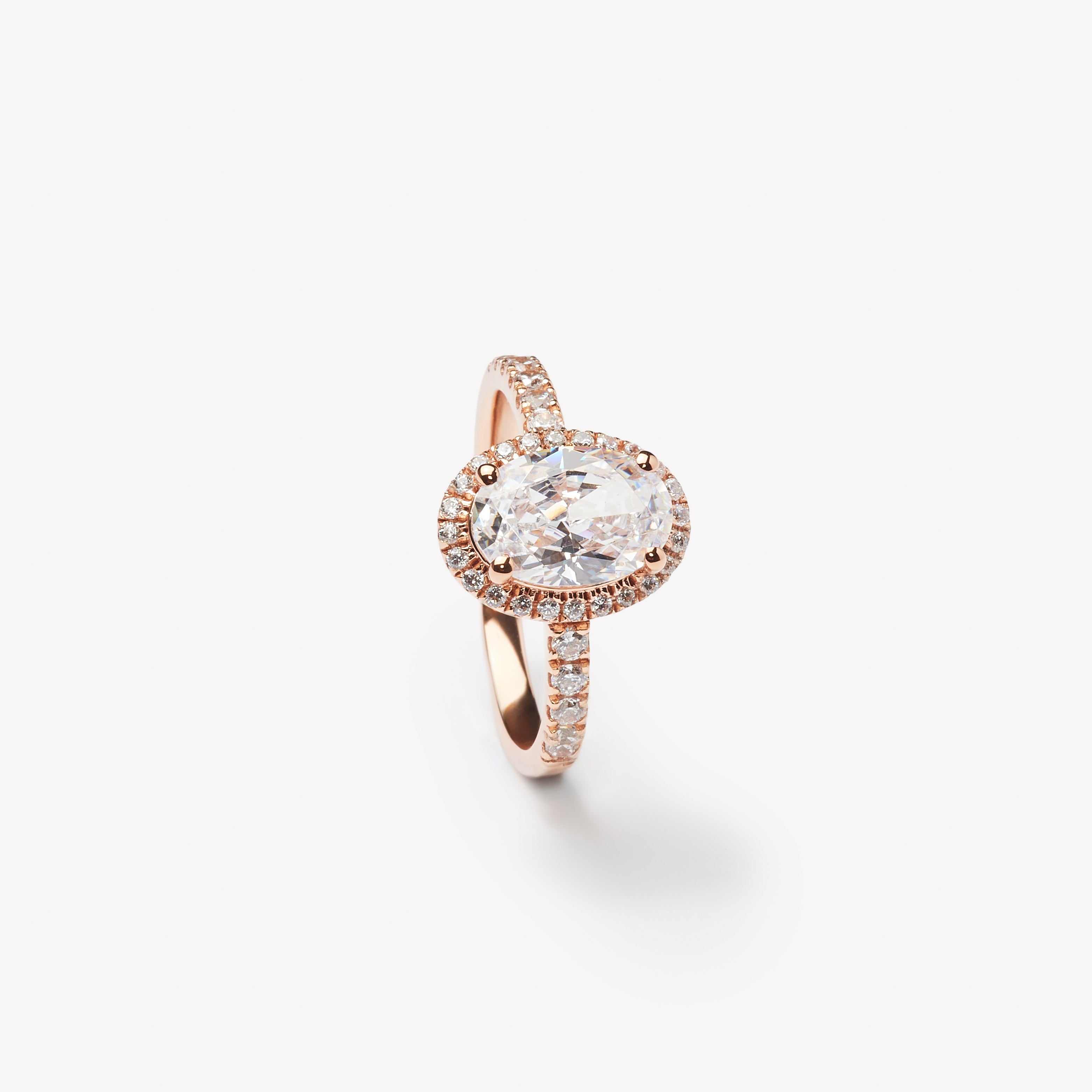 Elegant oval cut engagement ring with halo by IRALIS – Zurich-designed fine jewelry with pave setting and VS1–VS2 clarity.
