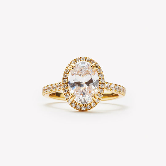 Elegant oval cut engagement ring with halo by IRALIS – Zurich-designed fine jewelry with pave setting and VS1–VS2 clarity.