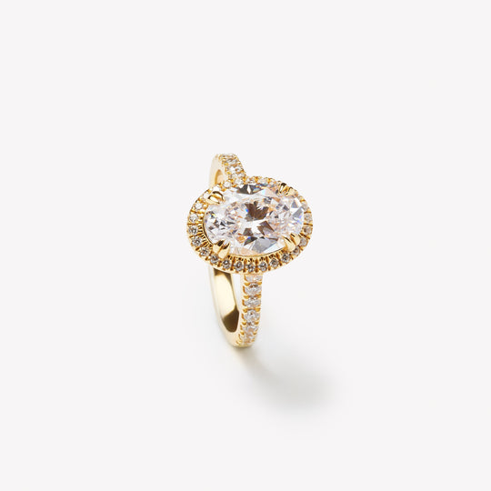 Elegant oval cut engagement ring with halo by IRALIS – Zurich-designed fine jewelry with pave setting and VS1–VS2 clarity.
