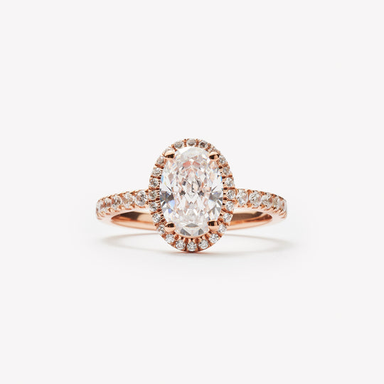 Elegant oval cut engagement ring with halo by IRALIS – Zurich-designed fine jewelry with pave setting and VS1–VS2 clarity.