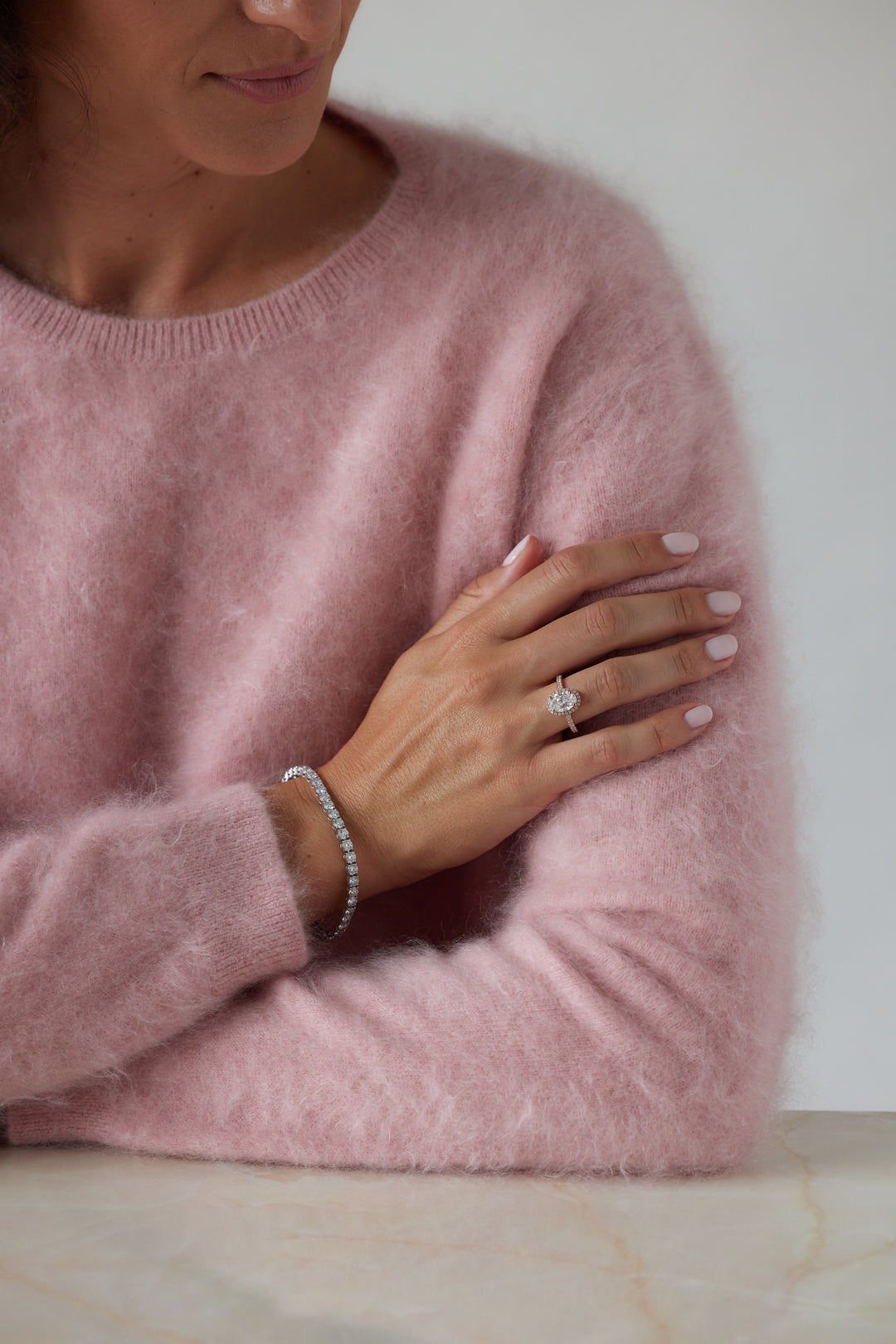 Elegant oval cut engagement ring with halo by IRALIS – Zurich-designed fine jewelry with pave setting and VS1–VS2 clarity.