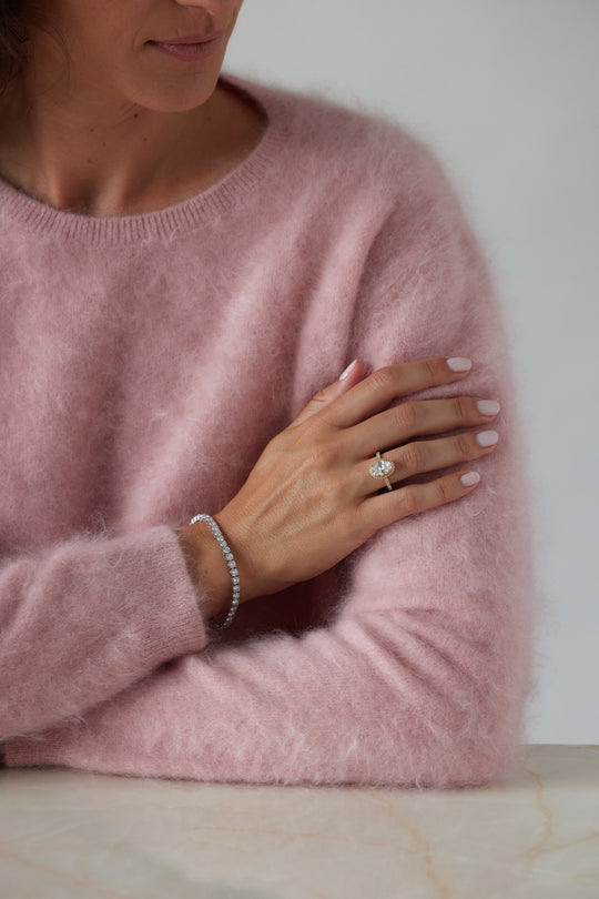 Elegant oval cut engagement ring with halo by IRALIS – Zurich-designed fine jewelry with pave setting and VS1–VS2 clarity.