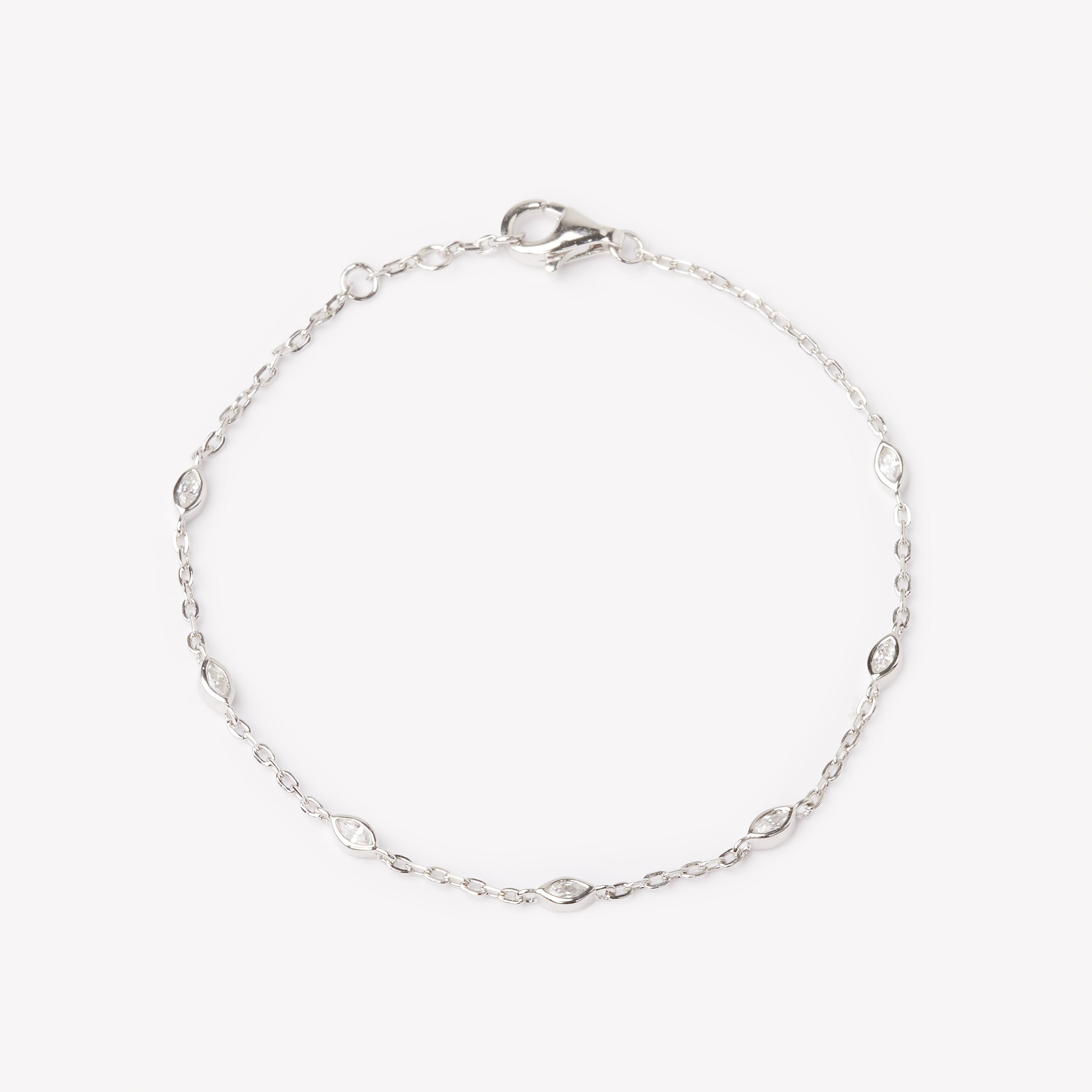 18k white gold bracelet with multiple marquise cut diamonds. Adjustable to different lengths.