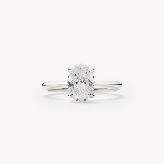 Oval cut engagement ring by IRALIS – Zurich-designed fine jewelry with plain knife setting, DEF color and VS1–VS2 clarity.