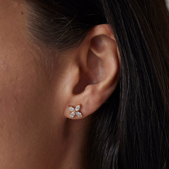18k rose gold capri earrings with lab grown diamonds. Marquise cut. On Model