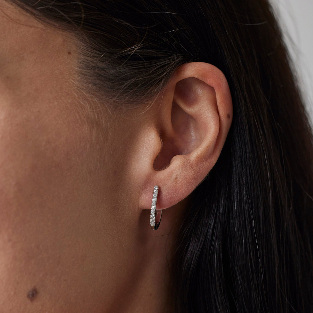 18k gold lab grown diamond earrings. On model.