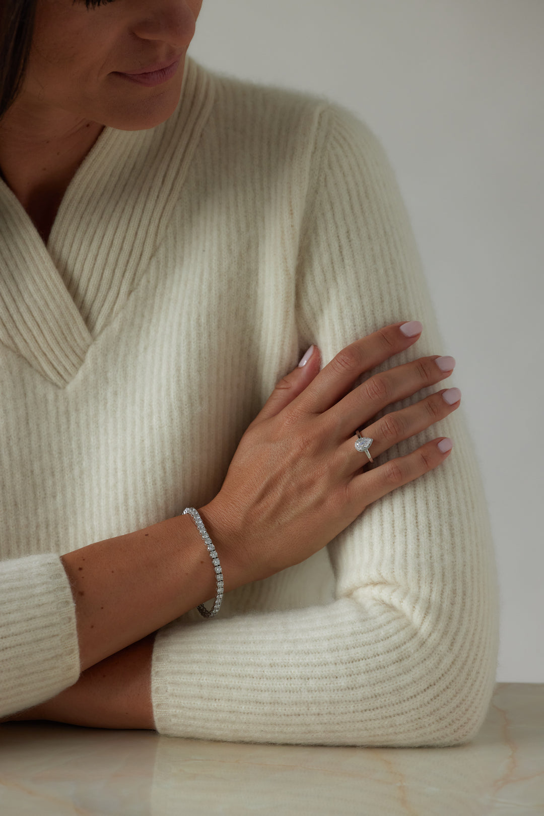 Pear cut engagement ring with halo by IRALIS – Zurich-designed fine jewelry with DEF color and VS1–VS2 clarity.