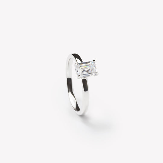Emerald cut engagement ring by IRALIS featuring lab-grown diamonds in DEF color and VS1–VS2 clarity, Zurich designed