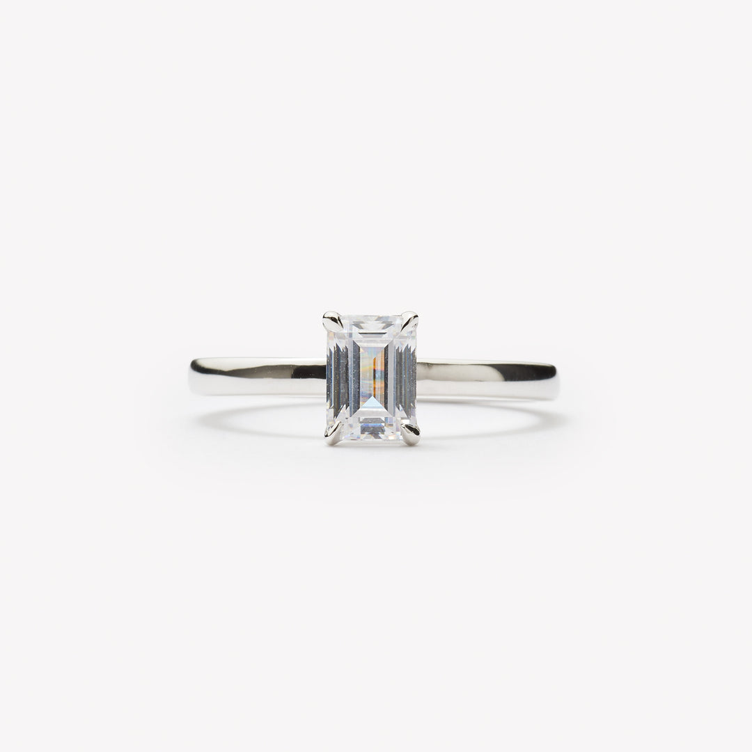 Emerald cut engagement ring by IRALIS featuring lab-grown diamonds in DEF color and VS1–VS2 clarity, Zurich designed