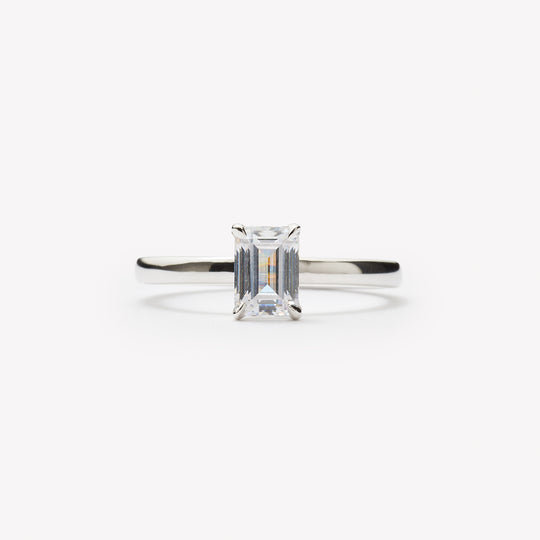 Emerald cut engagement ring by IRALIS featuring lab-grown diamonds in DEF color and VS1–VS2 clarity, Zurich designed