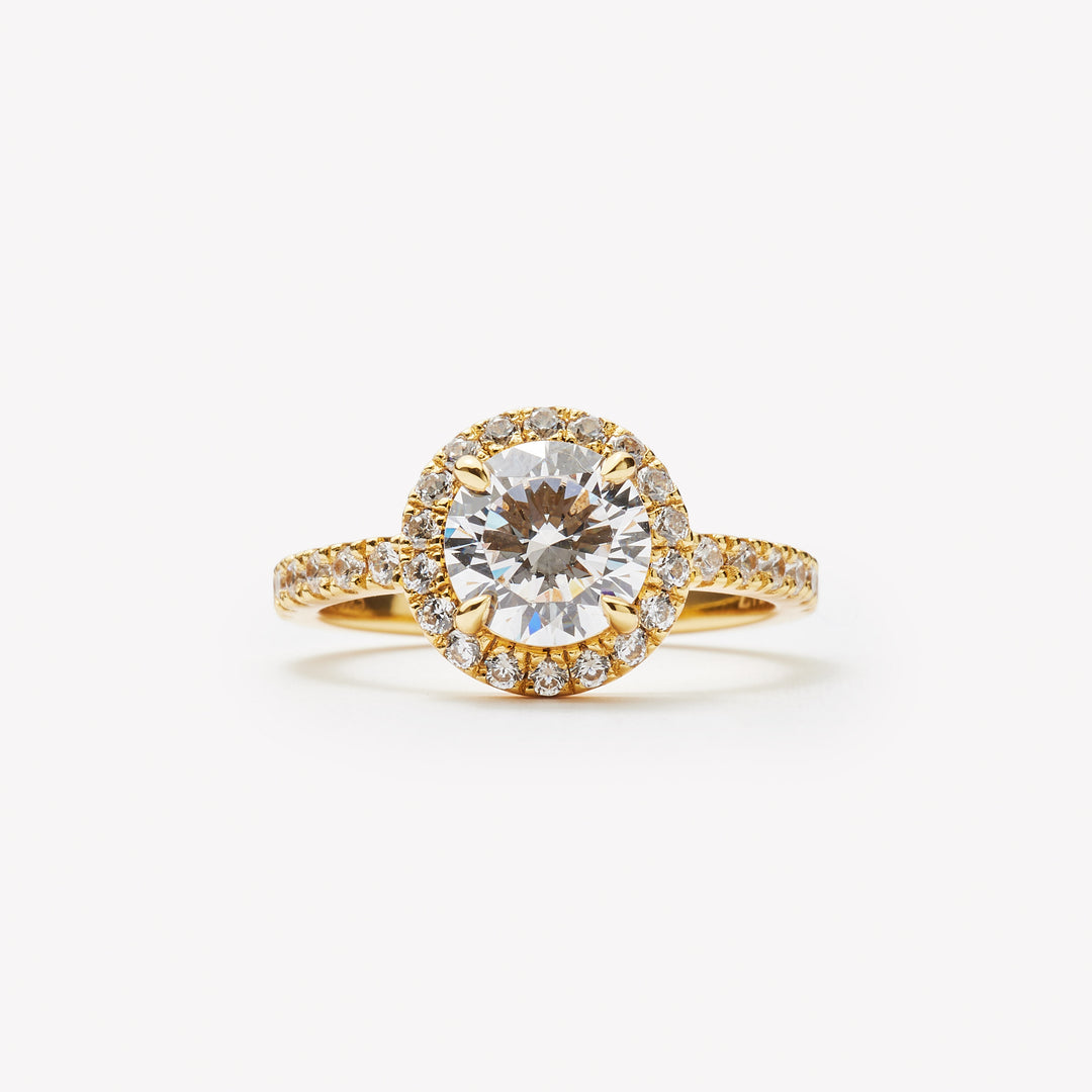 Round brilliant cut halo engagement ring by IRALIS – Zurich-designed fine jewelry with VS1–VS2 clarity and pave setting.