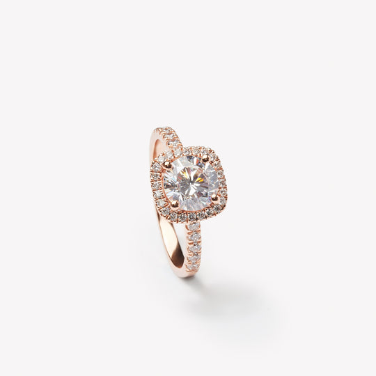 Round cut engagement ring with square halo by IRALIS – Zurich-designed fine jewelry with pave setting and VS1–VS2 clarity.