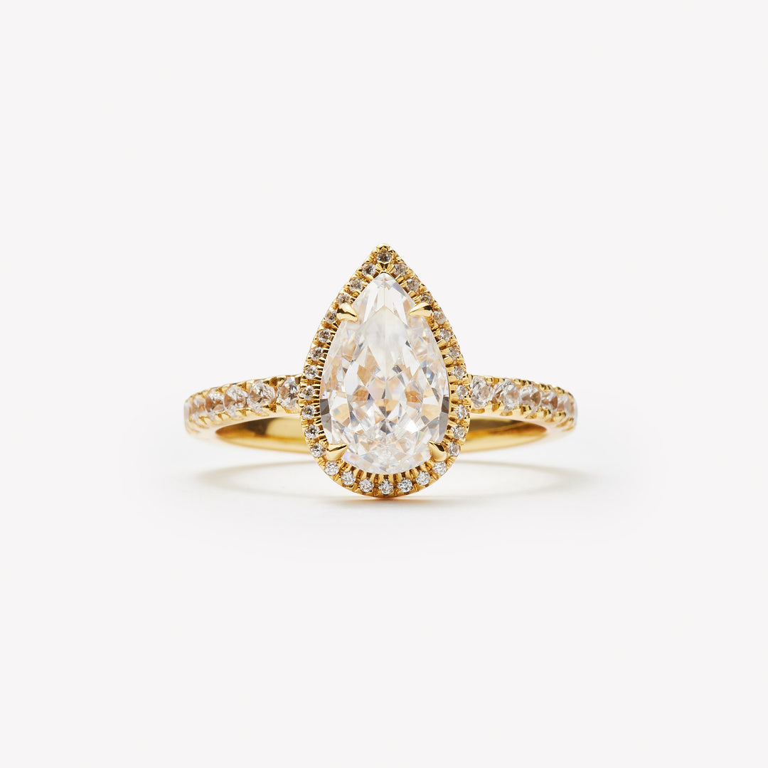 Pear cut engagement ring with halo by IRALIS – Zurich-designed fine jewelry with pave ring setting and VS1–VS2 clarity.