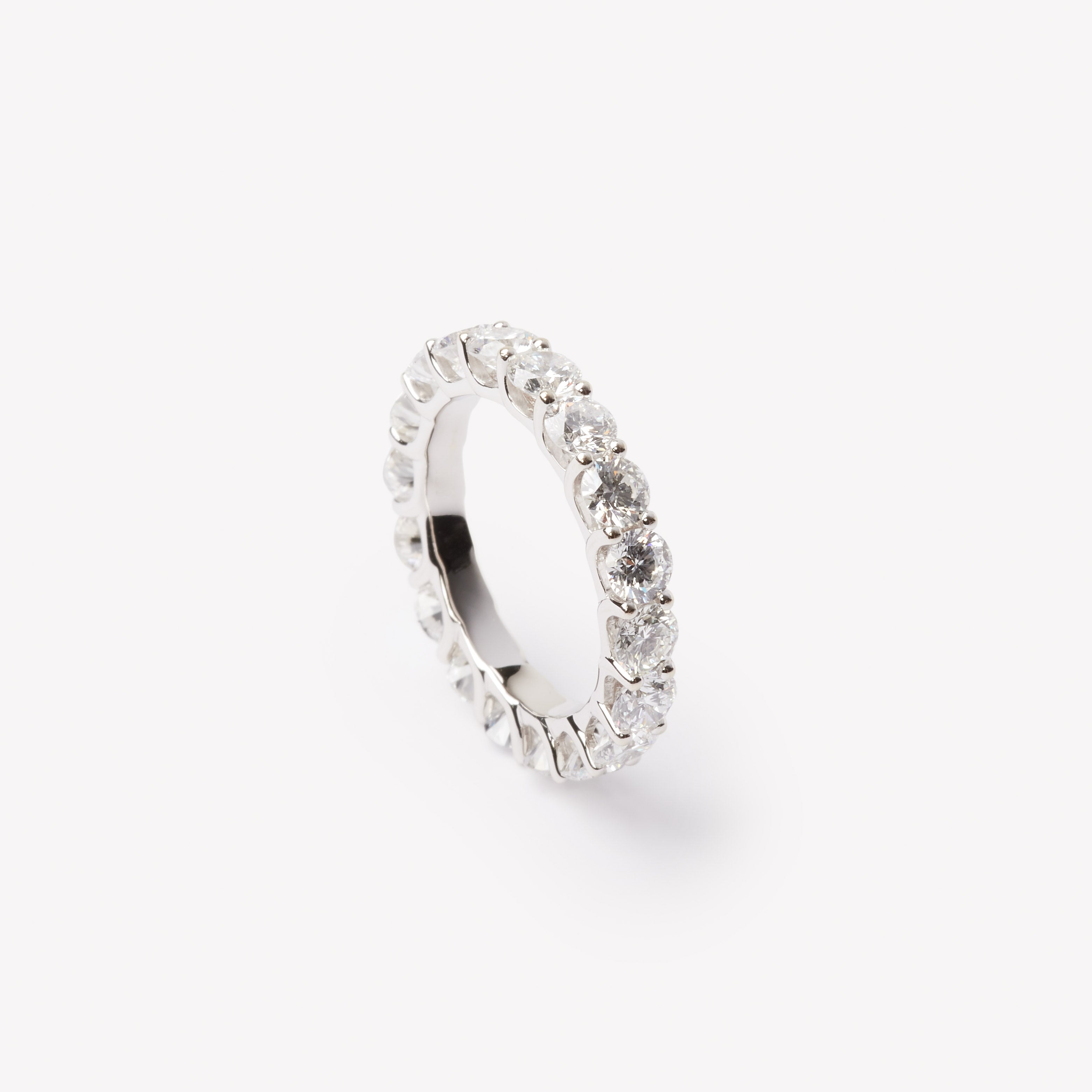 Round brilliant cut eternity ring by IRALIS featuring lab-grown diamonds in DEF color and VS1–VS2 clarity, Zurich designed