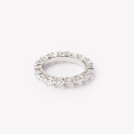 Round brilliant cut eternity ring by IRALIS featuring lab-grown diamonds in DEF color and VS1–VS2 clarity, Zurich designed