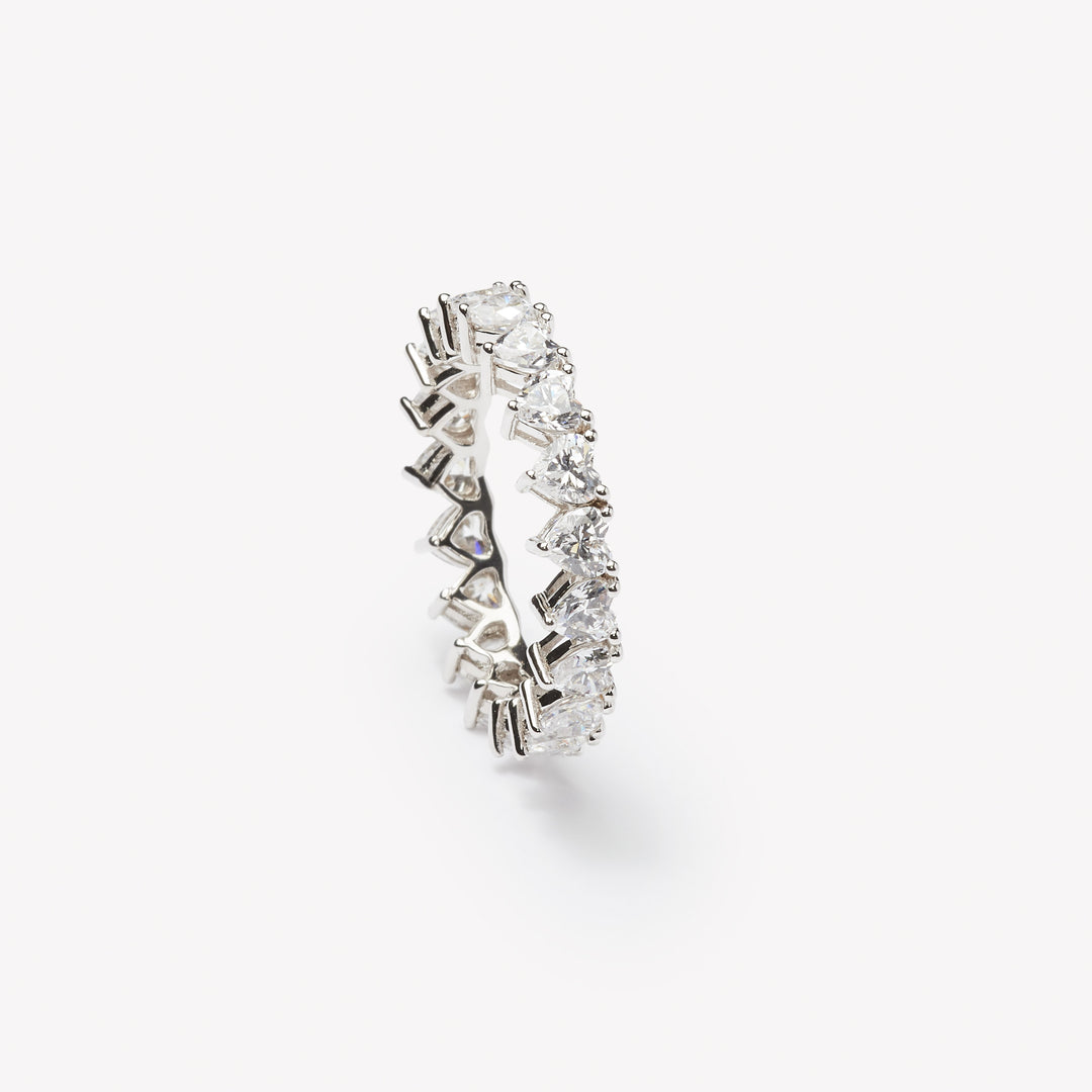 Heart cut eternity ring by IRALIS – Zurich-designed fine jewelry featuring DEF color and VS1–VS2 clarity.